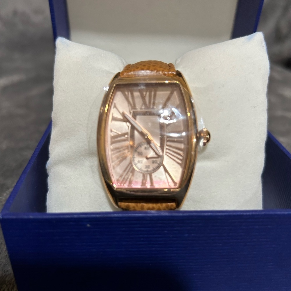 Women’s gold tone, camel band fashion watch